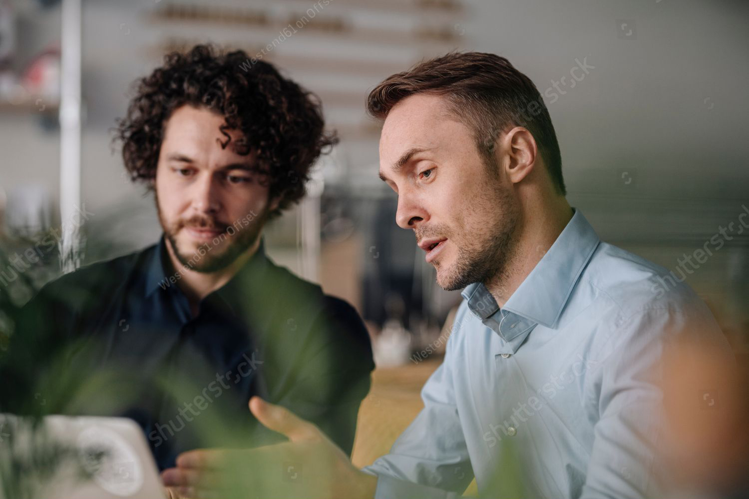 Stock Photo Two Businessmen Having A Meeting In A Coffee Shop 2150303759