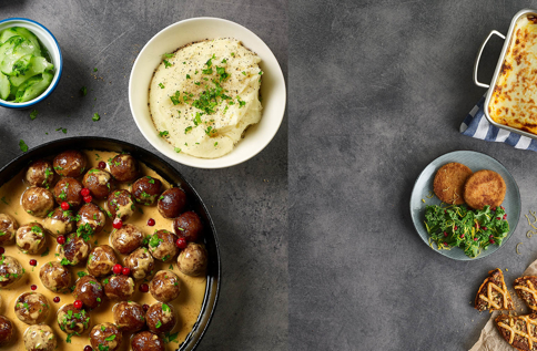 Dafgårds maträtter serverade på bord med köttbullar, potatismos, gratäng och tillbehör som visar brett sortiment av färdiglagad mat
